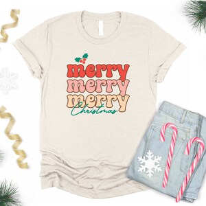 Frohe frohe frohe Weihnachten Retro Weihnachtsmädchen-Frauen-Haferbrei-Hemd-Frauen-Retro Art-T-Stück grüne frohe Weihnachten Hemd