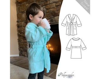 May include: A child wearing a light blue fleece robe with a tie belt. The robe has a shawl collar and pockets. The child is holding a white mug. The image also includes a line drawing of the robe in two different views. The text "New Sizes!" is in the upper right corner of the image. The text "Pollywoggles" is in the lower right corner of the image.