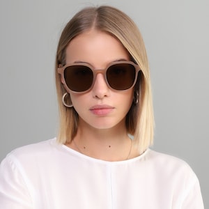 Oversized ronde zonnebril voor dames in de kleur beige, zwart, oranje en kastanjebruin met glazen met UV400-bescherming
