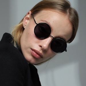 Custom trendy 90s style designer black round circle sunglasses UV400 anti-reflective sun lenses and flex temples. Ukrainian shop. 
Frame width 130 mm (5,11 inches)
Bridge 23 mm (0,90 inches)
Temple length 140 mm (5,51 inches)