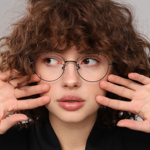 Round mod glasses frames for women with non prescription or prescription lenses with a unique design.