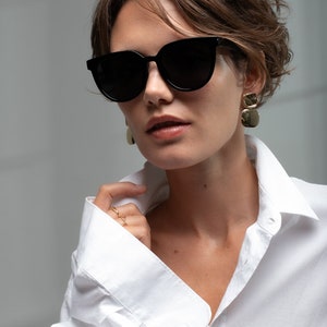 Modern sunglasses women with a unique design with polarized lenses UV400 protection