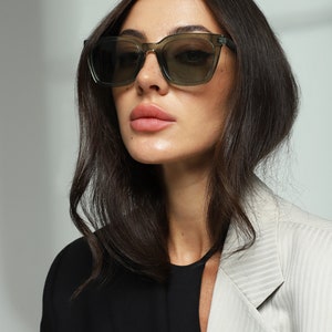 Green transparent trendy chunky square sunglasses women with polarized lenses UV400 protection.