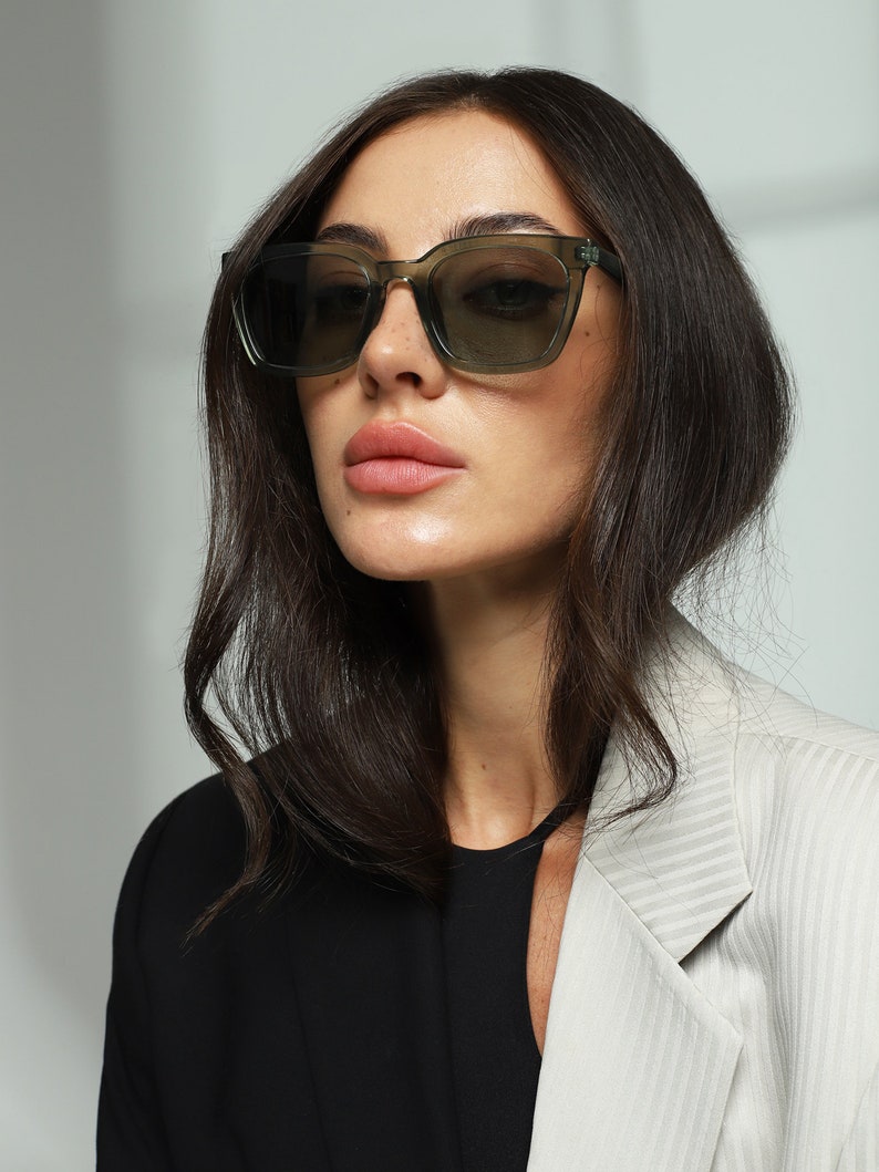Green transparent trendy chunky square sunglasses women with polarized lenses UV400 protection.