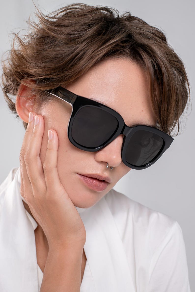 Black statement sunglasses designed for medium face shapes
