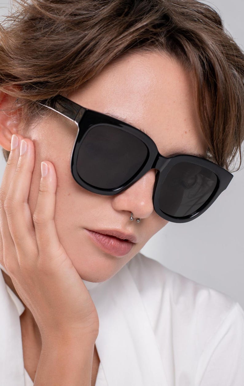 Large black sunglasses designed for comfortable everyday wear and sun protection