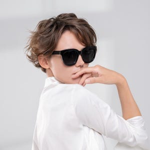 Oversized polarized sunglasses styled with minimalist fashion and everyday elegance