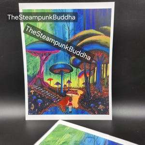 May include: A colorful fantasy art print featuring a whimsical mushroom forest with a path and a figure with an umbrella. The artwork has vibrant blues, greens, reds, and purples. Text on the print reads "TheSteampunkBuddha".