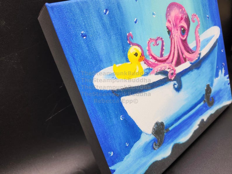 May include: A whimsical painting depicts a pink octopus in a white bathtub with a yellow rubber duck. The background is a gradient of blue, with water droplets and seahorse details. The artwork is on a canvas.