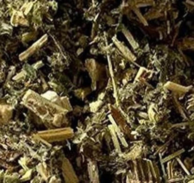 May include: Close-up of dried herbs, featuring a mix of green, brown, and tan plant matter. The image shows a variety of textures, including small leaves and larger, segmented pieces. The overall appearance suggests a natural, organic product.