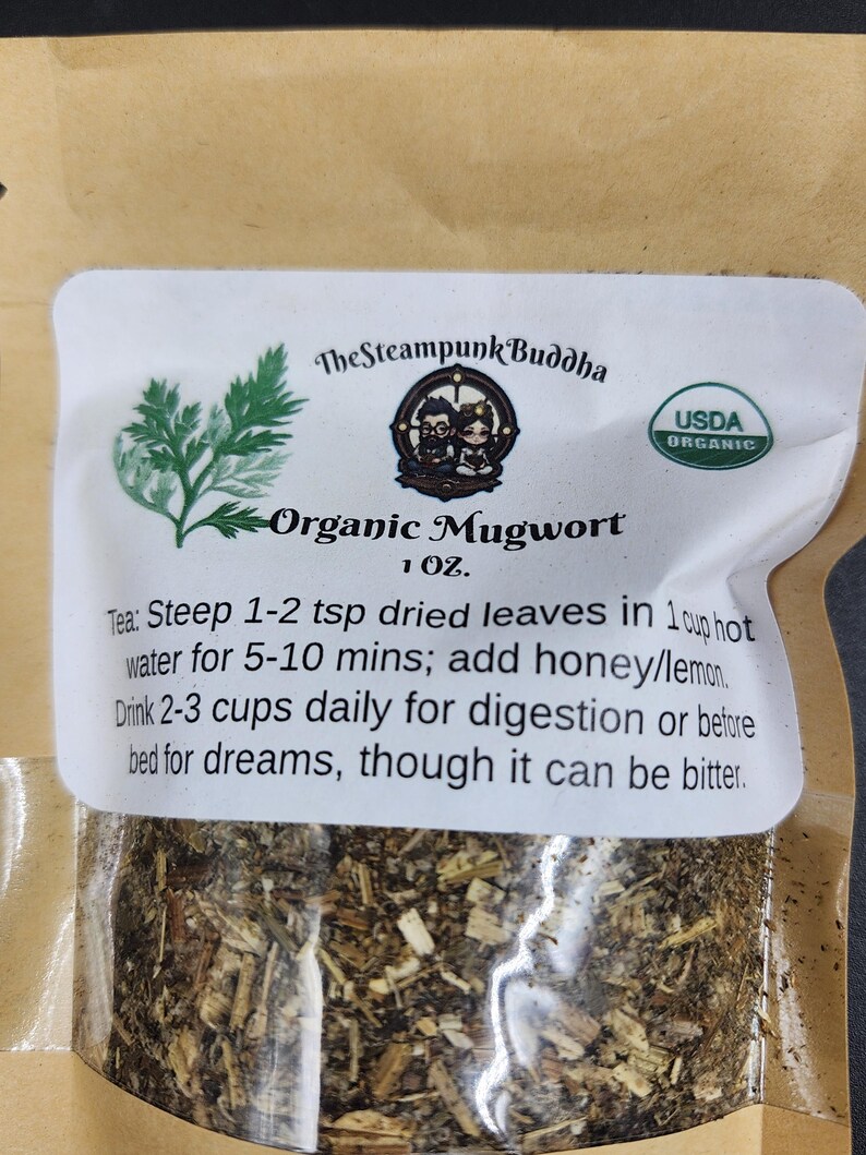 May include: A clear bag of organic mugwort tea. The label reads "The Steampunk Buddha" and "USDA Organic." Instructions are included: steep 1-2 tsp dried leaves in 1 cup hot water for 5-10 mins; add honey/lemon.