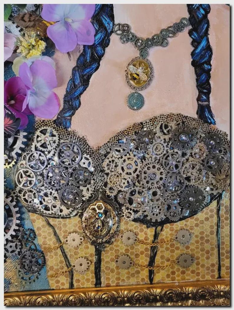 May include: A mixed media artwork featuring a bodice adorned with numerous metallic gears and cogs, a central bee-themed pendant, and a necklace with a bee charm. The piece includes blue braided hair elements, purple fabric flowers, and a honeycomb pattern.