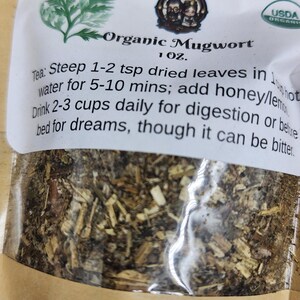 May include: A package of organic mugwort tea from The Steampunk Buddha. The label includes instructions for steeping the tea and a USDA organic seal. The tea is for digestion or before bed for dreams.