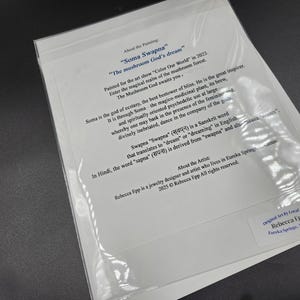 May include: A white paper with text inside a clear plastic sleeve. The text describes the painting "Soma Swapna" and its inspiration. The artist's name and location are also included.