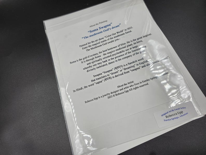 May include: A white paper with text inside a clear plastic sleeve. The text describes the painting "Soma Swapna" and its inspiration. The artist's name and location are also included.