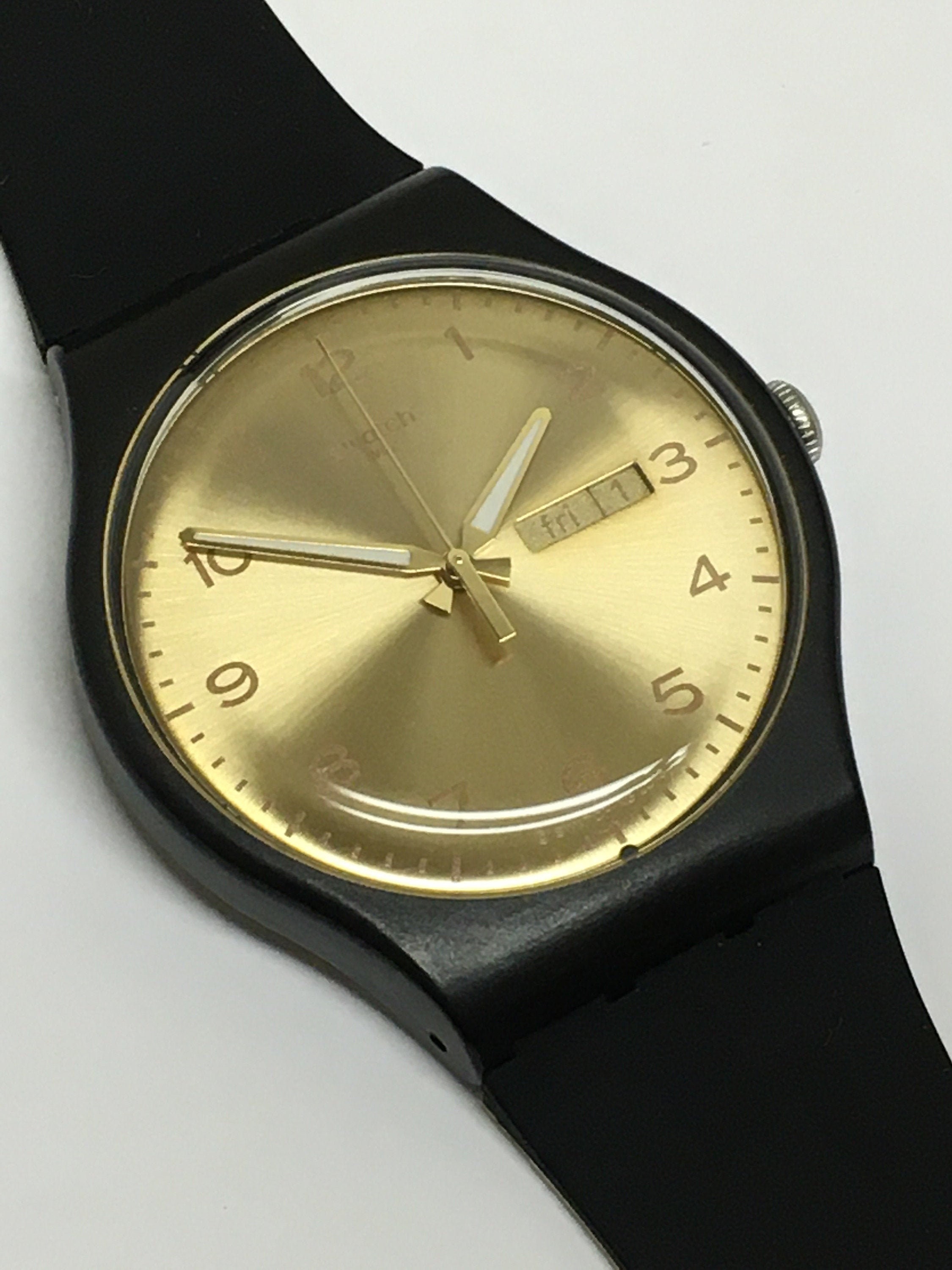 Swatch black shop and gold