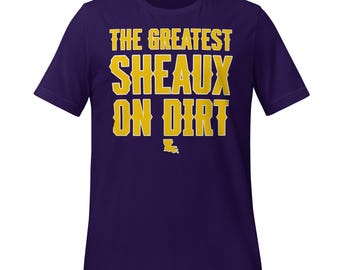 The Greatest Sheaux on Dirt Tee – Bold Purple & Gold Baseball Shirt