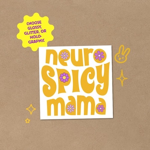 May include: A white sticker with the words "neuro spicy mama" in orange, decorated with purple flowers. A yellow starburst shape with text is in the upper left corner. A small bunny and stars are in the upper right corner.