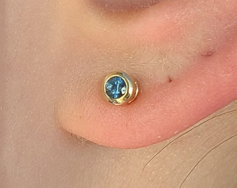 14k gold  Montana Sapphire studs. 14k gold bezel sapphire studs.