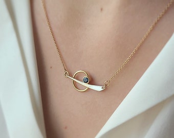 Montana Sapphire necklace. Montana sapphire silver and gold necklace on gold paper clip chain.