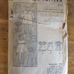May include: Vintage Butterick sewing pattern for an 18-inch (45.7 cm) Patsy doll. The pattern includes designs for a coat, dress, jumper dress, slip, pajamas, and apron. The cover is aged with illustrations of the doll in various outfits.
