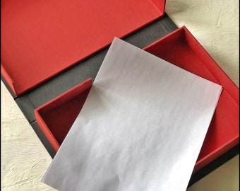 A4 Clamshell box hand bound in Black buckram and red book cloth | Solander box |