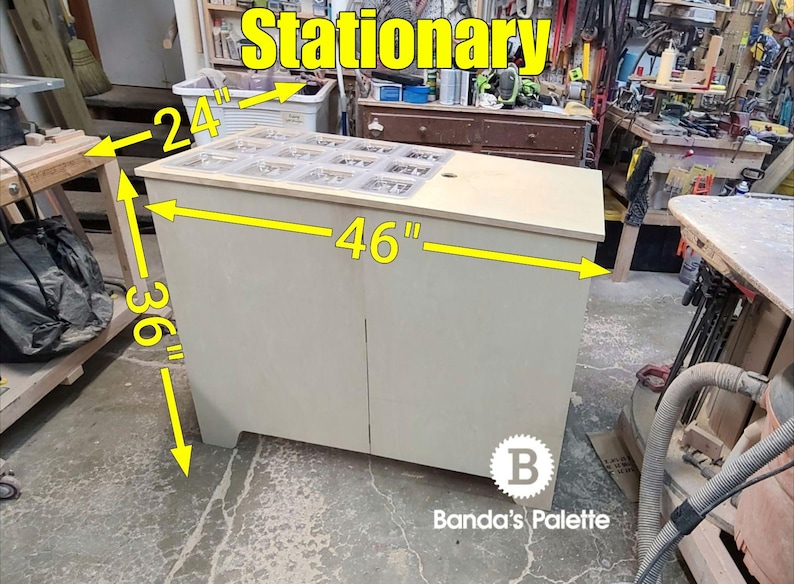 May include: A light wood stationary organiser with a clear top and two doors. The organiser is 46 inches wide, 36 inches tall, and 24 inches deep.