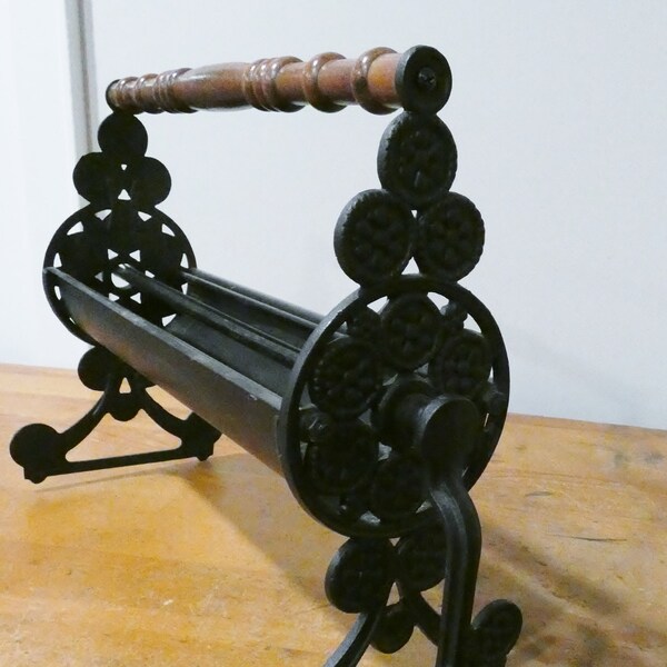 70s Paper Log Roller, cast iron, wooden handles