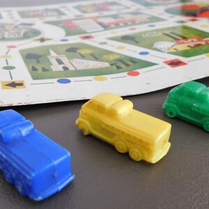 60s Fire Fighters game board with spinner, three magnetic plastic fire trucks, 1964