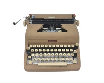 1955 Banana Yellow Royal Quiet Deluxe portable typewriter with case.