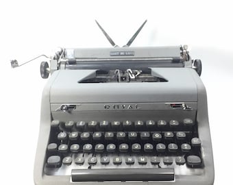 1955 Banana Yellow Royal Quiet Deluxe portable typewriter with case.