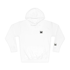 May include: A white long-sleeve hooded sweatshirt featuring a small black and white graphic of a vintage typewriter on the center chest and a matching smaller typewriter graphic on the lower portion of the left sleeve, with a drawstring hood.
