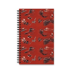 May include: Spiral-bound notebook with a red cover featuring a repeating pattern of vintage mechanical objects in black and white. The design includes typewriters, cameras, and other retro items, creating a nostalgic aesthetic.