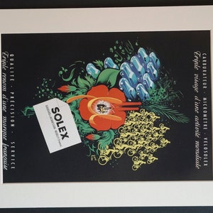 May include: A vintage advertisement for Solex featuring a red flower with green leaves and a cluster of blue and white cars. The background is black with a white border. The text reads "CARBURATEUR - MICROMETRE - VELOSOLEX Triple visage d'une activité mondiale SOLEX GOUDARD & MENNESSON - NEUILLY (France) QUALITÉ - PRÉCISION - SERVICE Triple renom d'une marque française"