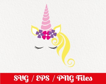 May include: A pink unicorn head with a yellow mane and a flower crown with pink and purple flowers. The unicorn has closed eyes.