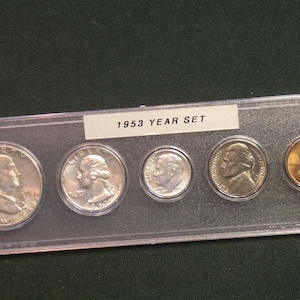 May include: A rustic wooden sign with the text "Welcome to our home" in a handwritten style. The sign features a distressed finish and a simple, inviting design, perfect for a front porch or entryway.