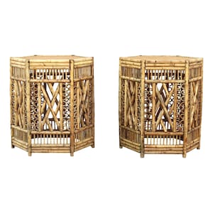 May include: Two hexagonal bamboo end tables with intricate woven designs. The tables are made of natural bamboo and have a light brown color.