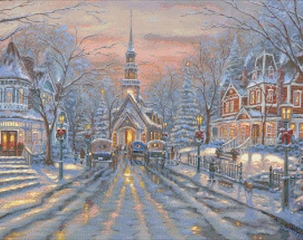 May include: A snowy winter scene with a small town, houses, and a church. The town is decorated with Christmas lights and a large evergreen tree. The sky is a soft pink and blue.