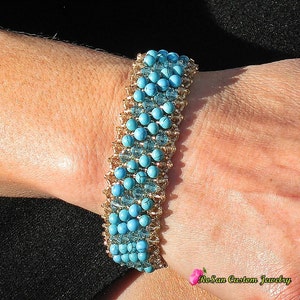 May include: A turquoise and gold beaded bracelet with a graduated design. The bracelet is made with small, round turquoise beads and gold spacer beads.
