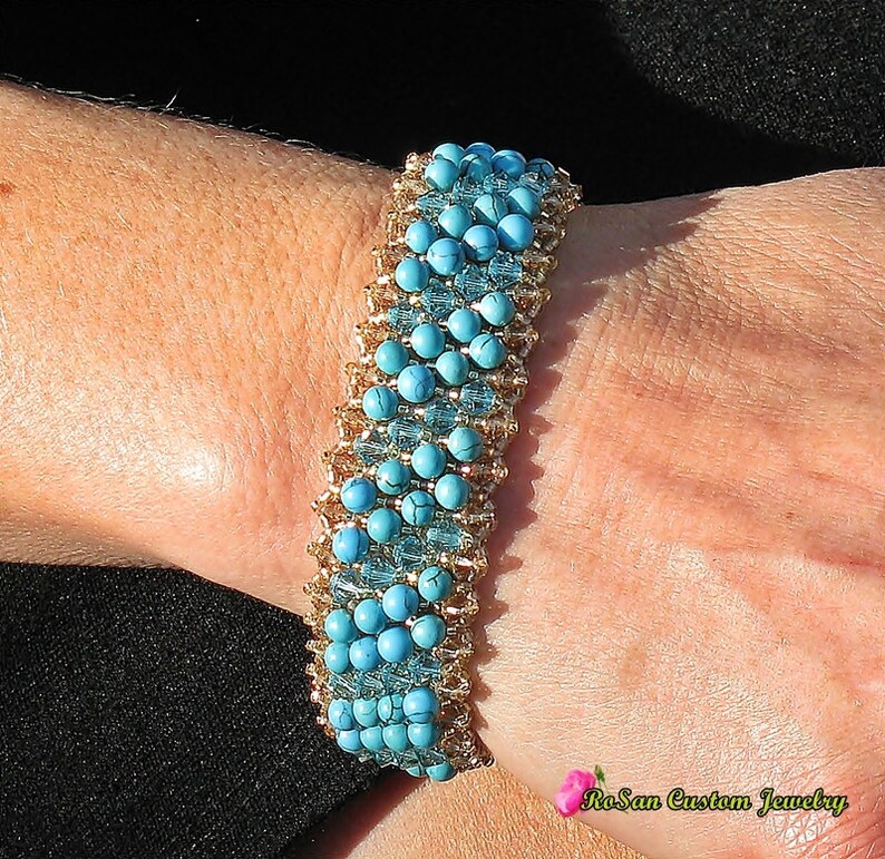 May include: A turquoise and gold beaded bracelet with a graduated design. The bracelet is made with small, round turquoise beads and gold spacer beads.