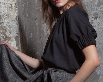 Blusa in rayon nero, a pipistrello