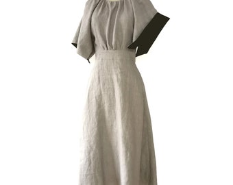 Beige linen dress, sleeves have black detail inside