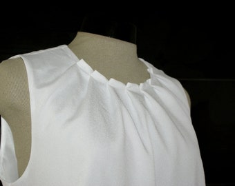 White top, folded neckline, sleeveless