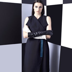 Black wrap dress, sleeveless, dark green belt and detail on back image 2