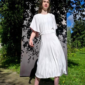 White rayon dress, sleeves have dusty pink detail inside