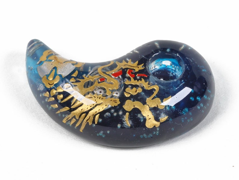 Hello from Japan.  This is a handmade magatama with Orgonite power. "Golden Dragon in Navy Blue".  It is a wonderful piece of art created by skilled craftsmen as a result of very precise and careful work.
