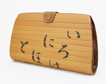 Bolso de mano de bambú japonés hecho a mano con interior de piel de vaca