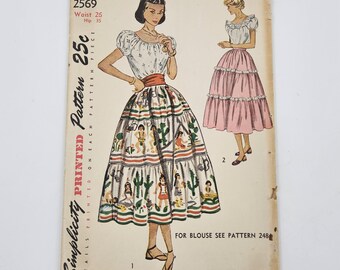May include: Vintage Simplicity sewing pattern for a skirt, featuring a detailed illustration of a tiered skirt with a Southwestern design. The pattern includes measurements for a 26-inch waist and 35-inch hips. The text on the pattern reads "Simplicity is America's Fashion."