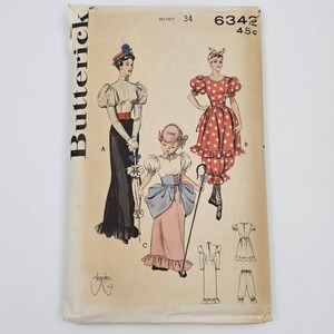 May include: Vintage Butterick sewing pattern envelope featuring illustrations of women's clothing designs. The envelope is tan with the word "Butterick" printed vertically on the left side. The designs include a long skirt, a polka dot dress, and other vintage styles.