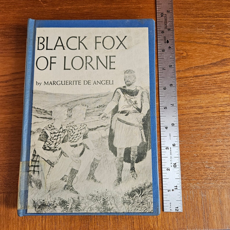 May include: A blue hardback book titled "Black Fox of Lorne" by Marguerite de Angeli. The cover features a black and white illustration of a man in a kilt and two children.